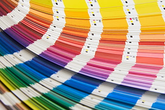 Close-up of colorful CMYK printing swatches fanned out