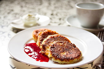 Golden Syrniki with Berry Sauce and Coffee