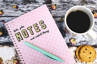 Pink Notebook, Coffee, and Cookies on Rustic Wood