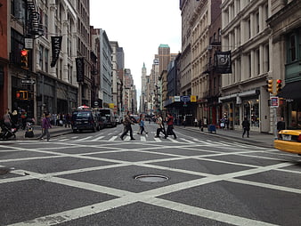 Busy New York City Street Intersection with Pedestrians