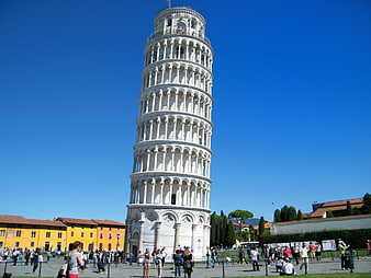 Leaning Tower of Pisa against blue sky with tourists