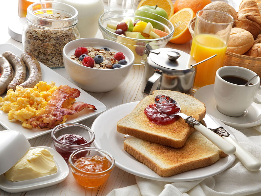 Delicious Full English Breakfast Spread With Toast, Eggs, Bacon, And Fresh Fruit