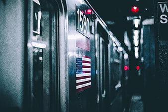 Close-up of subway train car with American flag sticker