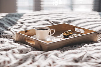 Wooden Breakfast Tray with Coffee and Chocolate on Bed