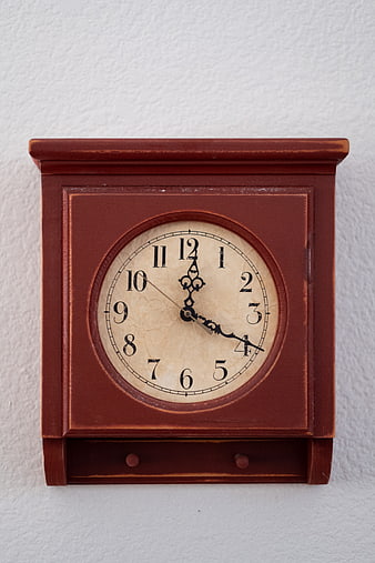 Vintage Wooden Wall Clock on White Textured Background