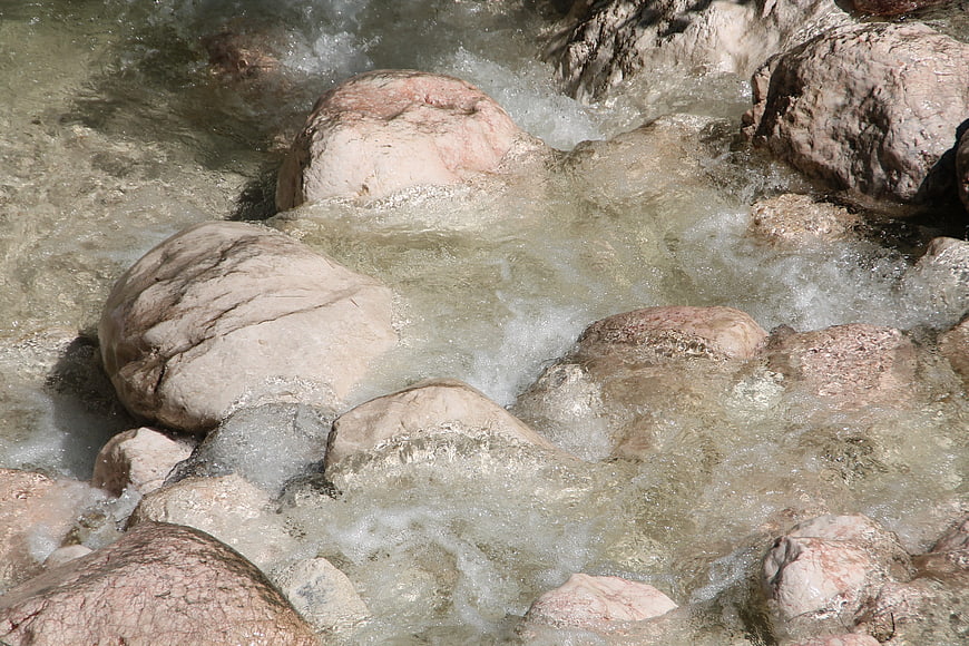 Clear Mountain Stream Flowing Over Smooth Rocks
