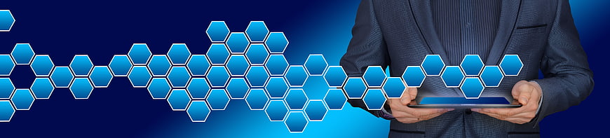 Businessman Holding Tablet With Blue Hexagonal Blockchain Network Graphic