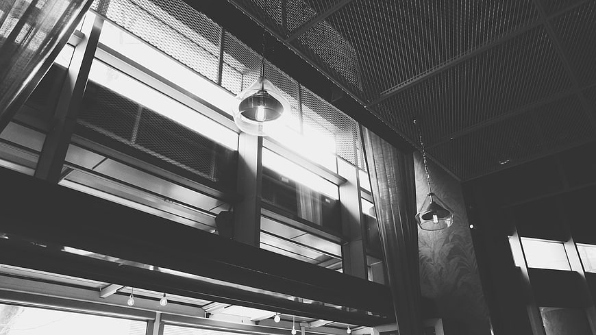Black and white industrial interior with hanging pendant lights