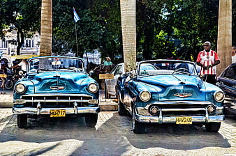 Two Vintage Blue Convertible Cars Parked in Havana