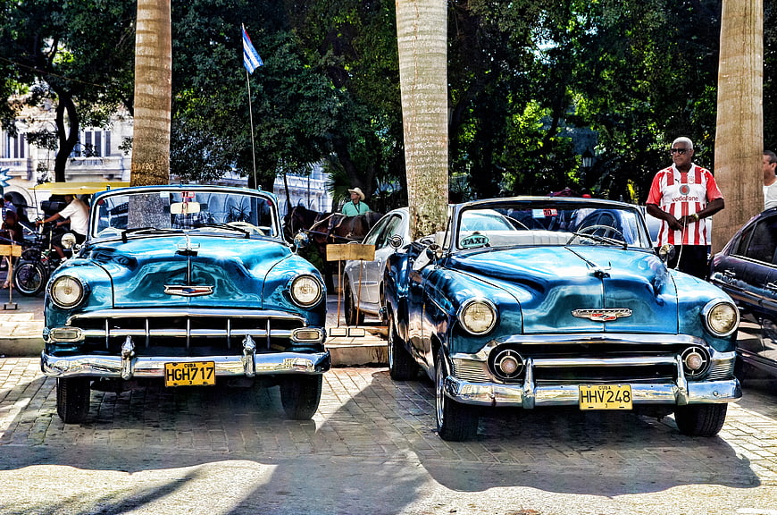 Two Vintage Blue Convertible Cars Parked in Havana
