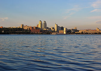 City Skyline Across River at Golden Hour