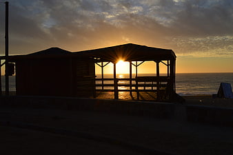 Silhouette of Beach Gazebo at Golden Sunset