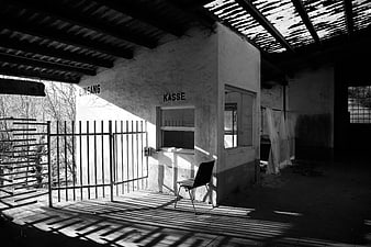 Abandoned Building Interior with German Text and Shadows