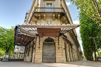Low angle view of historic French building with Bar du Casino sign