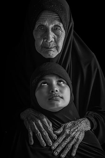 Black and white portrait of elderly grandmother and young girl