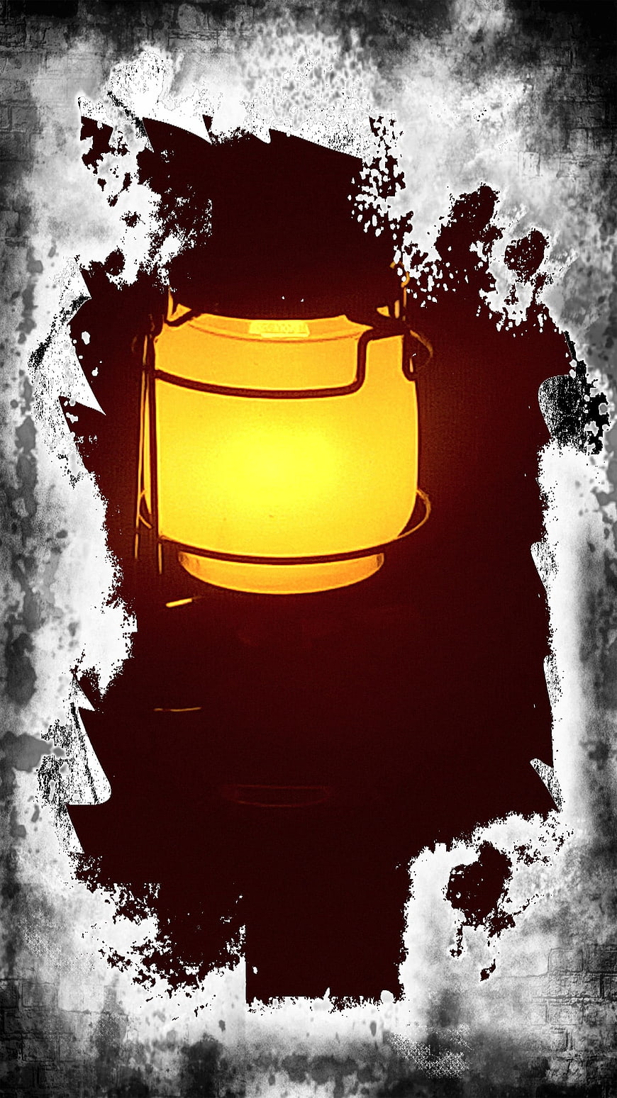 Glowing yellow lantern on dark grunge background