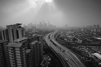 Black and white cityscape with highway and skyscrapers