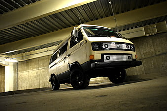 White VW Vanagon Off-Road Van in Parking Garage