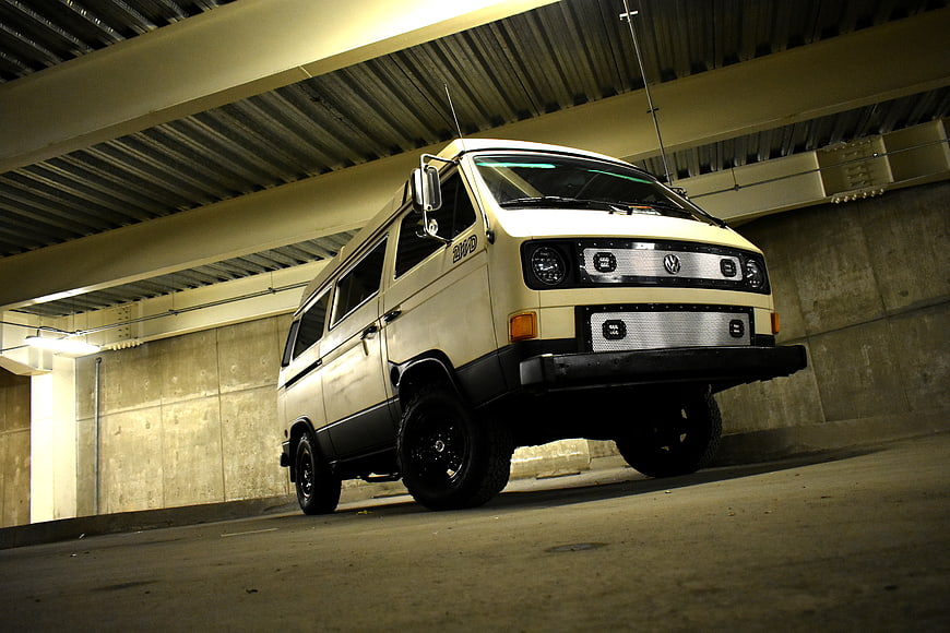 White VW Vanagon Off-Road Van in Parking Garage