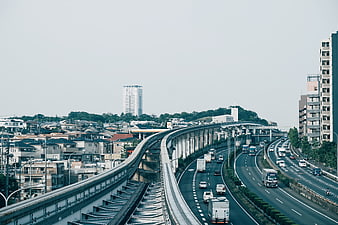 Elevated highway and train tracks in urban cityscape