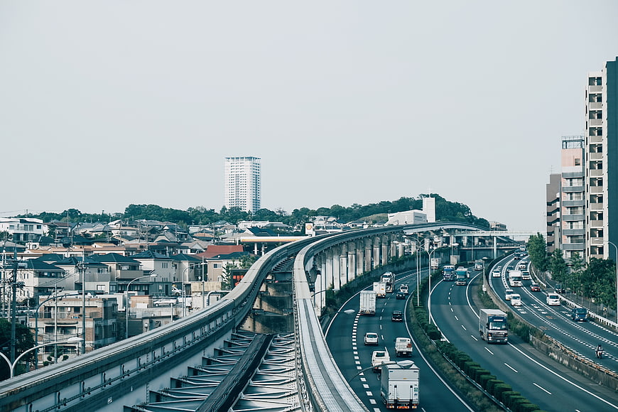 Elevated highway and train tracks in urban cityscape