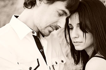 Intimate Black and White Portrait of a Young Couple Sharing a Quiet Moment