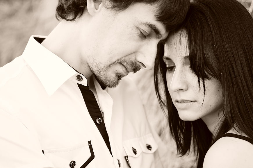 Intimate Black and White Portrait of a Young Couple Sharing a Quiet Moment