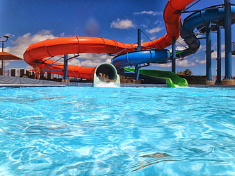Colorful water slides at a sunny outdoor water park