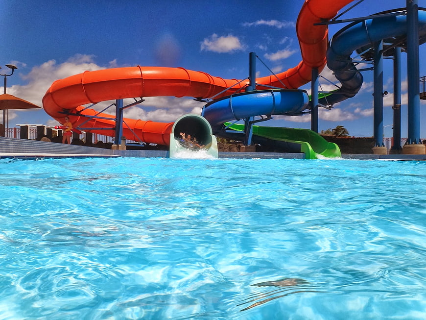 Colorful water slides at a sunny outdoor water park