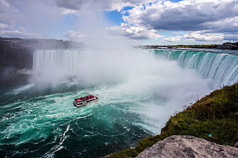 Maid of the Mist boat navigating the misty waters of Niagara Falls