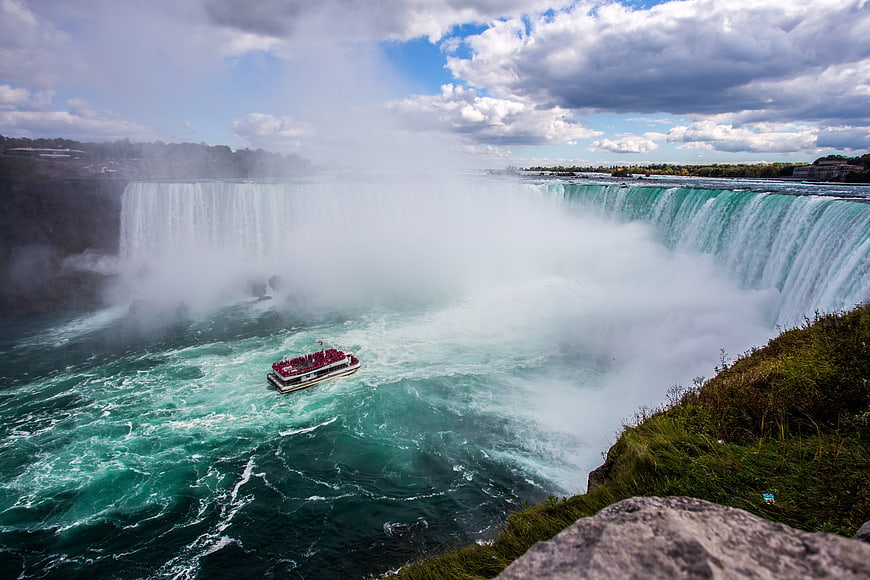 Maid of the Mist boat navigating the misty waters of Niagara Falls