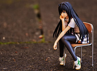 Anime Girl Figure Sitting Thoughtfully on Chair