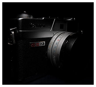 Vintage Canon G-III QL Film Camera on Black Background