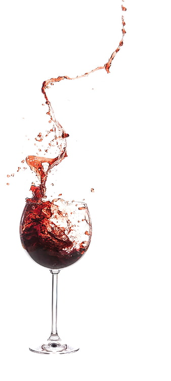 Red wine splash in glass on white background