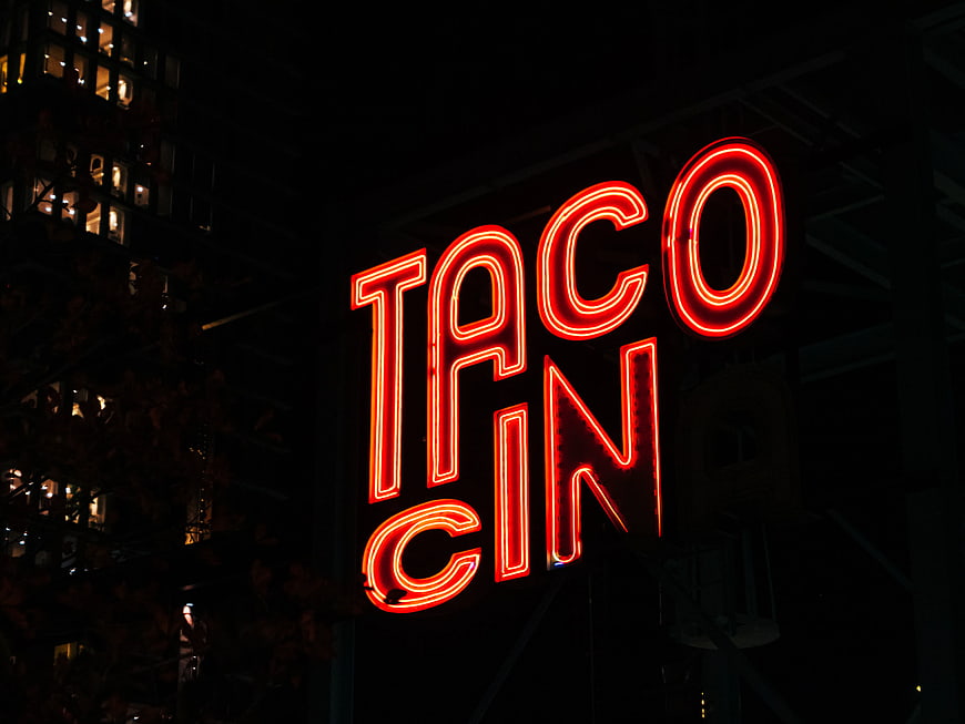 Red Neon Taco Sign at Night