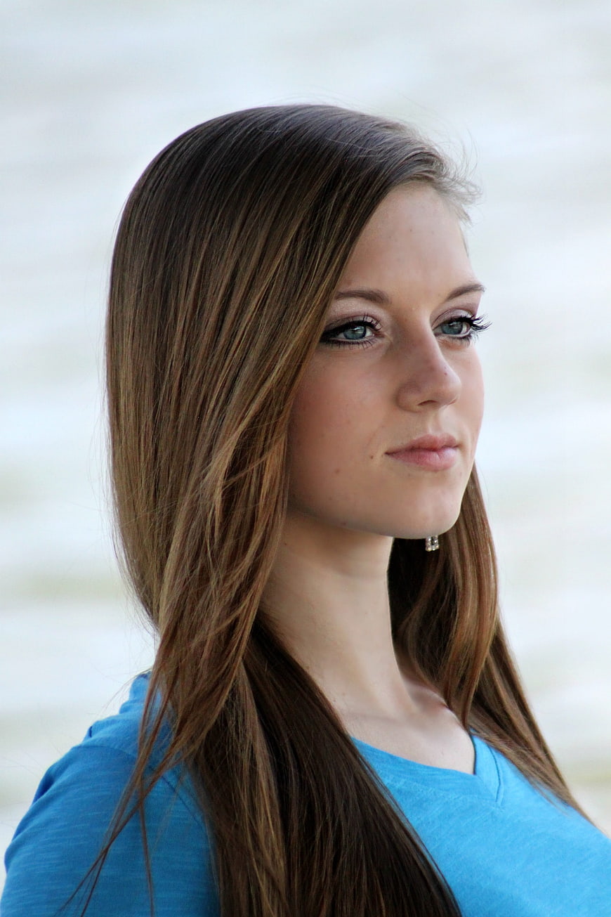 Portrait of Young Woman with Long Brown Hair and Blue Eyes