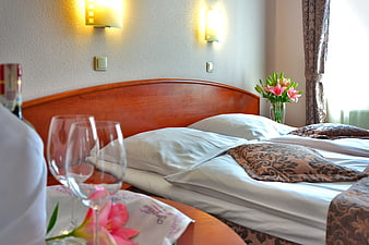 Romantic Hotel Room with Wine and Flowers