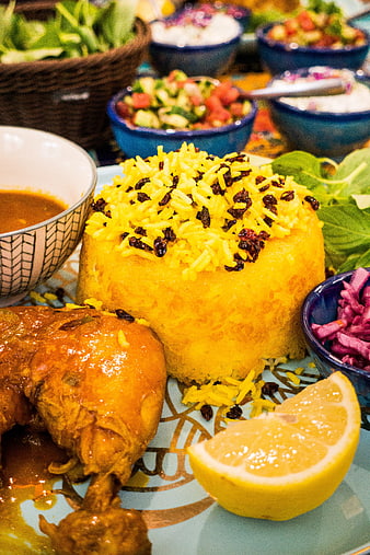 Traditional Iranian saffron rice with chicken and lemon