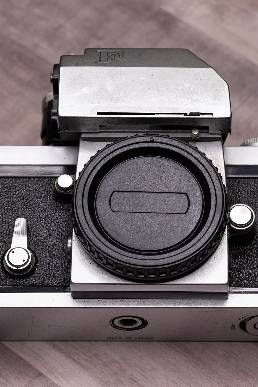 Close-up of vintage Pentax film camera on wooden surface
