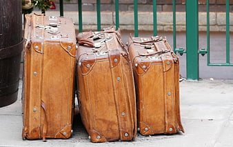 Vintage Leather Suitcases on Sidewalk
