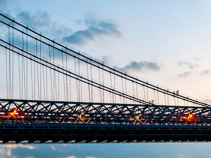 Williamsburg Bridge Steel Structure at Dusk with Reflection