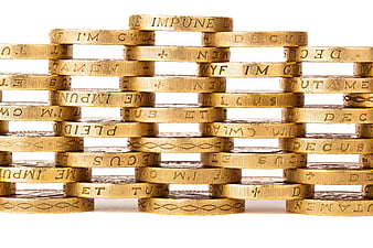 Gold coins stacked in a brick wall pattern on white background