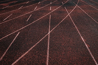 Red Running Track Surface with White Lane Lines
