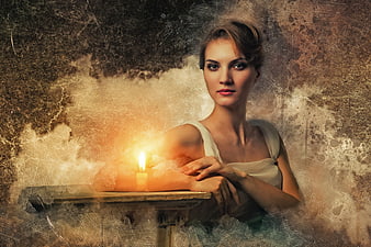 Mysterious woman portrait with candle and vintage grunge texture