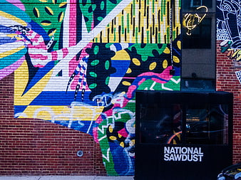 Colorful Abstract Mural on Brick Wall with National Sawdust Sign