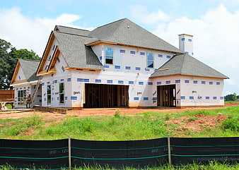 New House Construction Site with House Wrap and Siding