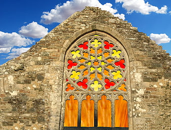Colorful Stained Glass Rose Window in Ancient Stone Ruins
