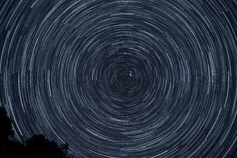 Hypnotic Star Trails Rotating Around Polaris in Night Sky