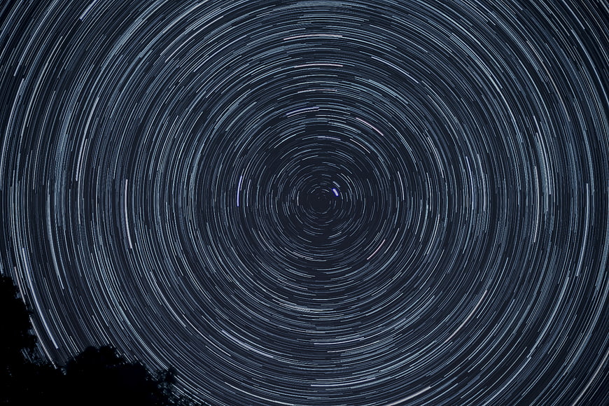 Hypnotic Star Trails Rotating Around Polaris in Night Sky