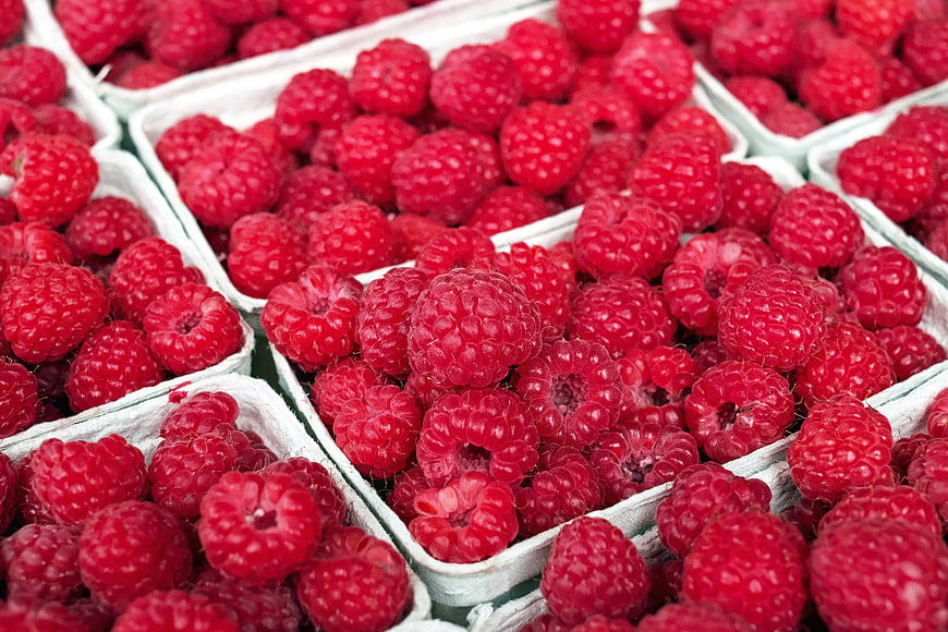 Fresh Red Raspberries in White Cardboard Containers